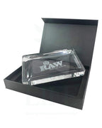RAW Crystal Glass Rolling Tray showing engraved RAW logo and polished edge