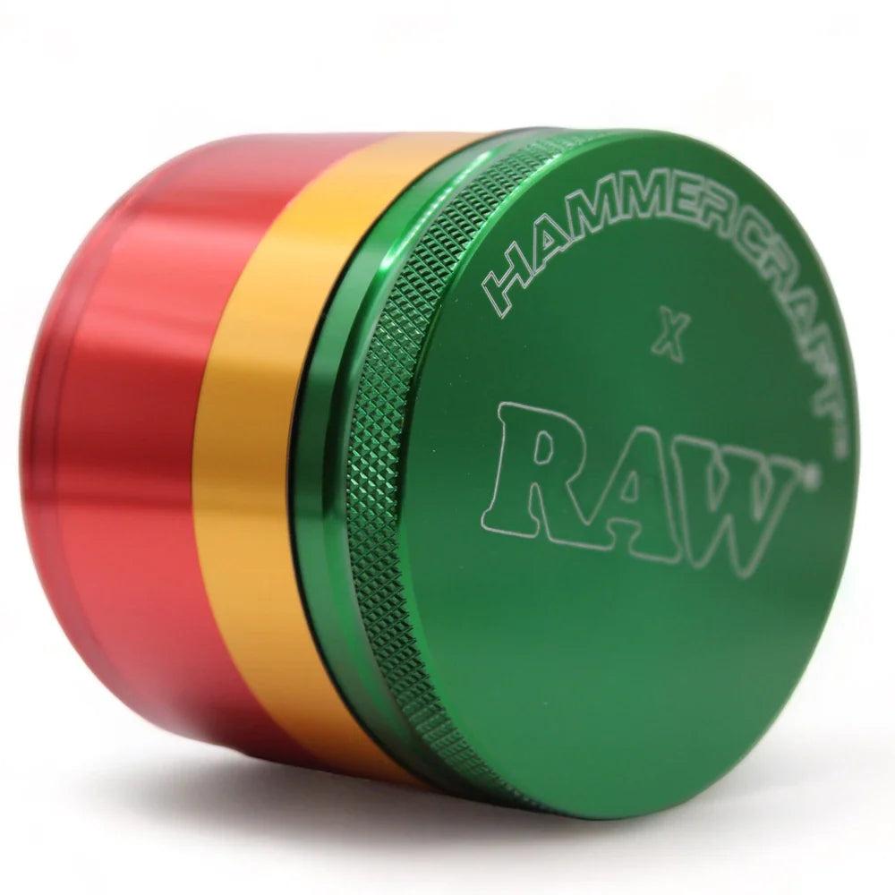 RAW x Hammercraft Rasta grinder open, showing diamond-cut teeth and mesh screen